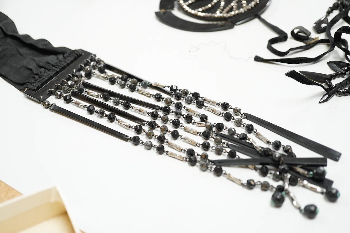 A quantity of assorted antique and later costume jewellery to include a silver and Marcasite ladies fob watch, a collection of cufflinks, brooches and a pair of drop earrings with screw backs